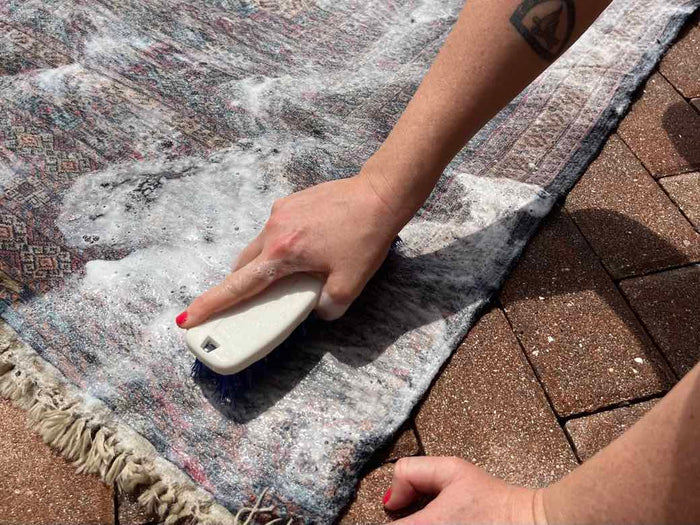 Cleaning antique rugs by hand