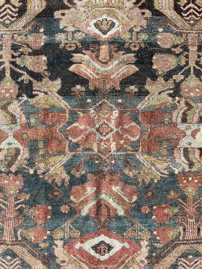 Hand-knotted vintage Persian rug at Woven Kin Home