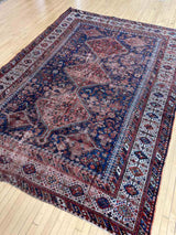 hand-knotted antique Persian Afshar area rug with medallions and an allover animal motif