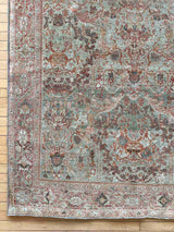 Corner of a  hand-knotted antique Persian Mahal area rug with allover botanical motifs on a celadon green field