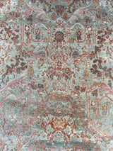 Close-up of a hand-knotted antique Persian Mahal area rug with allover botanical motifs on a celadon green field