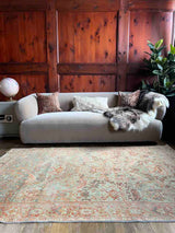 Living room with a hand-knotted antique Persian Mahal area rug with allover botanical motifs on a celadon green field