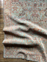 Corner of a hand-knotted antique Persian Mahal area rug with allover botanical motifs on a celadon green field