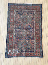 back of an Antique Persian accent rug 