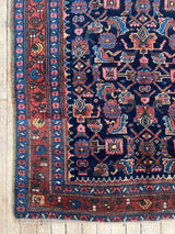 Antique Persian area rug corner close-up at Woven Kin Home