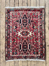 Red vintage Persian Karajah rug with colorful medallions