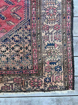 Antique Persian area rug corner close-up