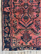 Close-up of a Vintage Persian area rug botanical motifs