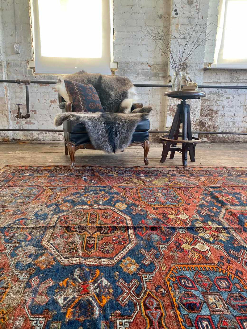 antique Caucasian area rug at Petrichor Vintage Co.