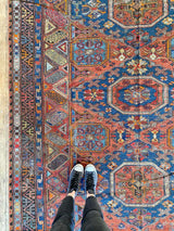 antique Caucasian area rug at Petrichor Vintage Co.