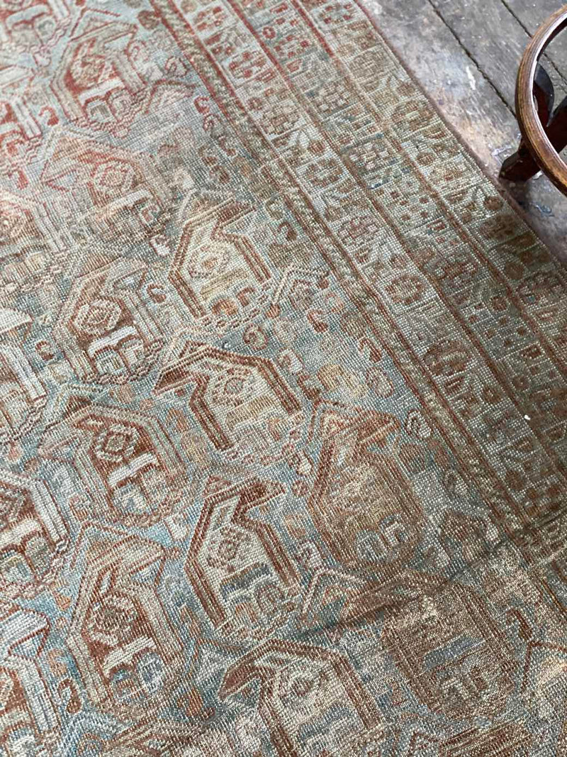 vintage Persian area rug at Petrichor Vintage Co.