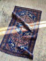 antique Persian accent rug