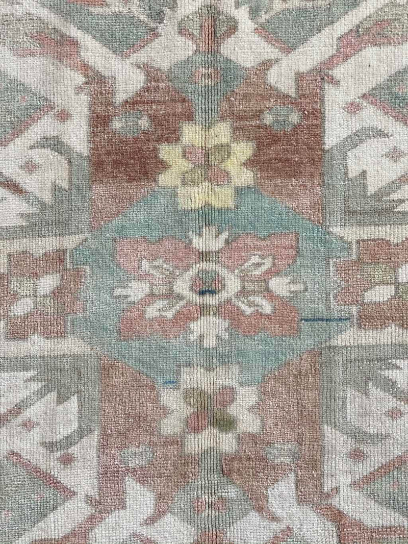 muted color vintage Turkish rug
